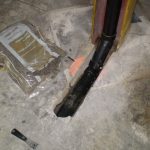 Suction point trenched into concrete slab